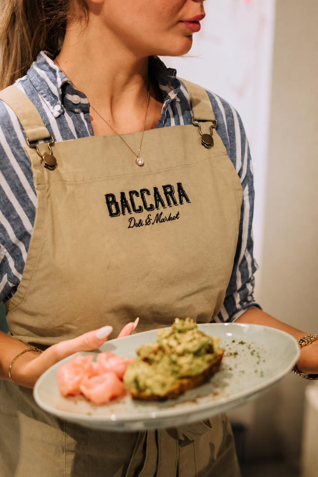 A BACCARA team member serving brunch